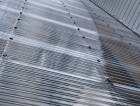 クリア色の新しいポリカ波板が施工された結城市の庇